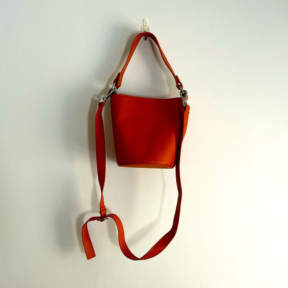 Hire Goods, mini bucket bag in orange. No longer make this color. Vegan leather